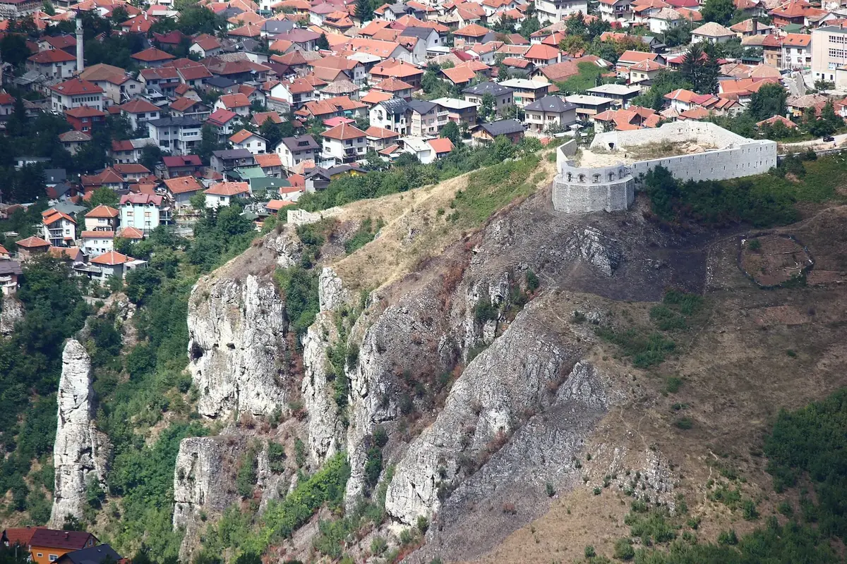 White fortress Sarajevo, Bijela tabija, on a rocky cliff edge with the houses of Vratnik behind it