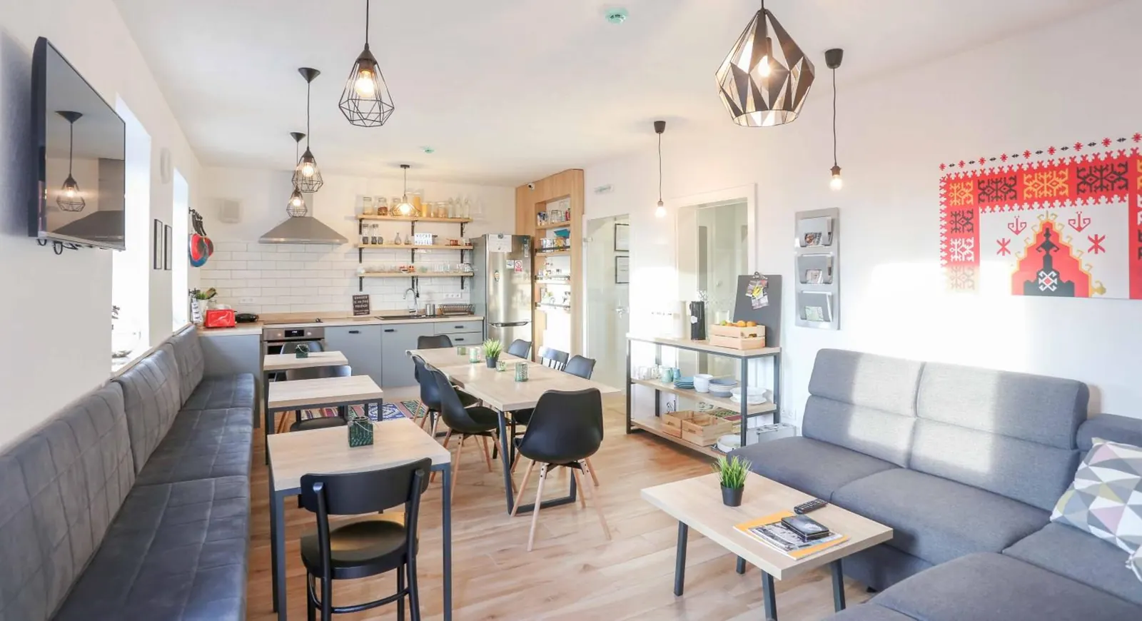 Our lounge, with sofas, tables and the kitchen behind