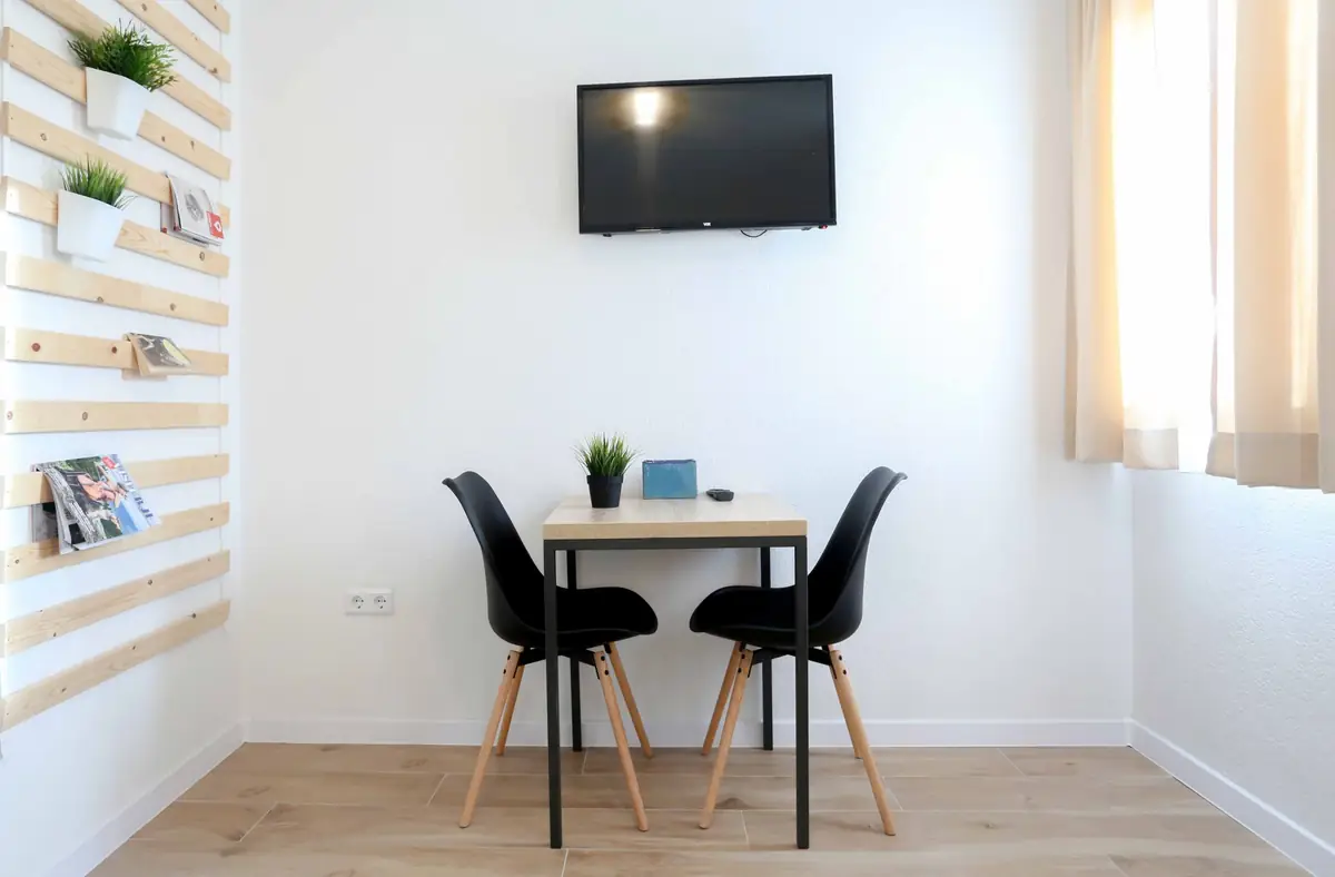A table and TV in the room
