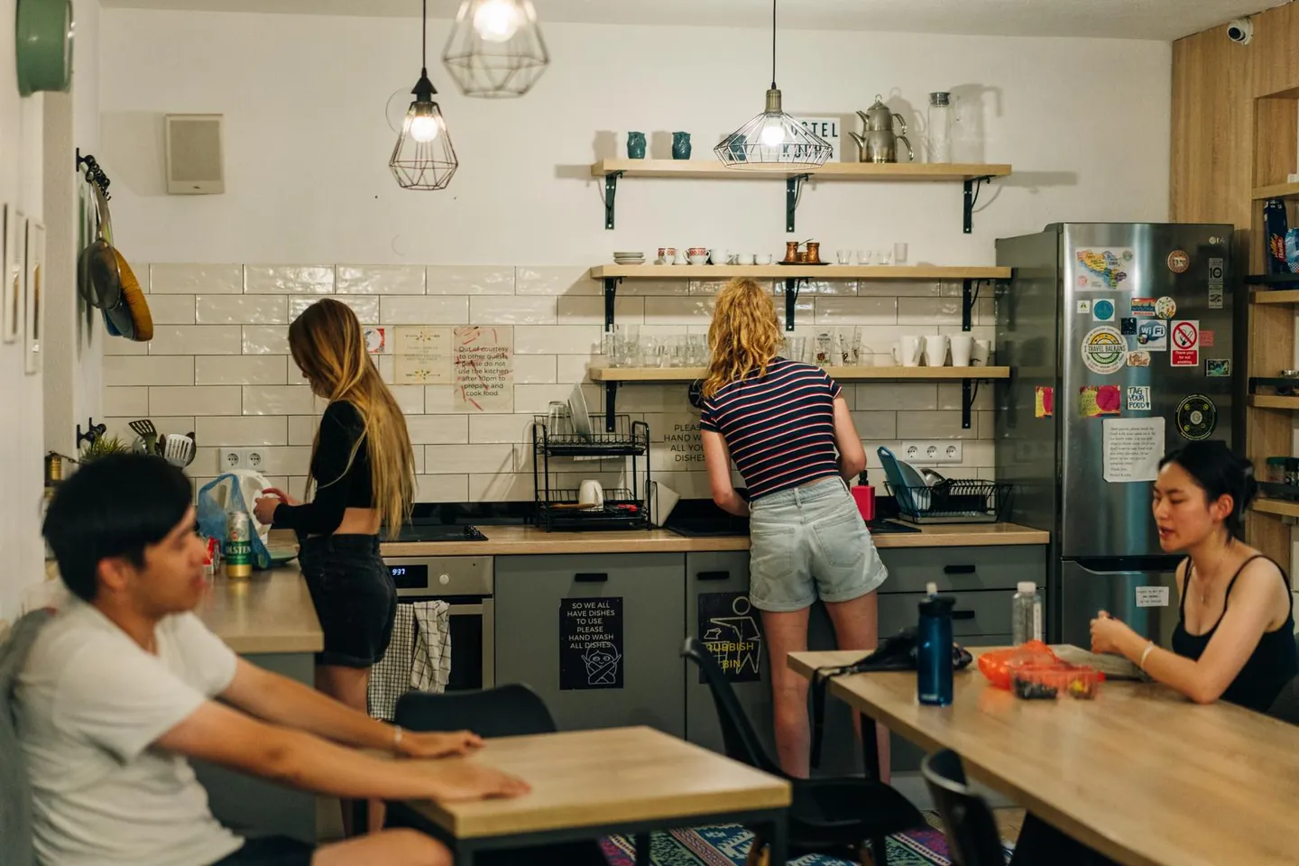 Guests cooking and talking in our kitchen